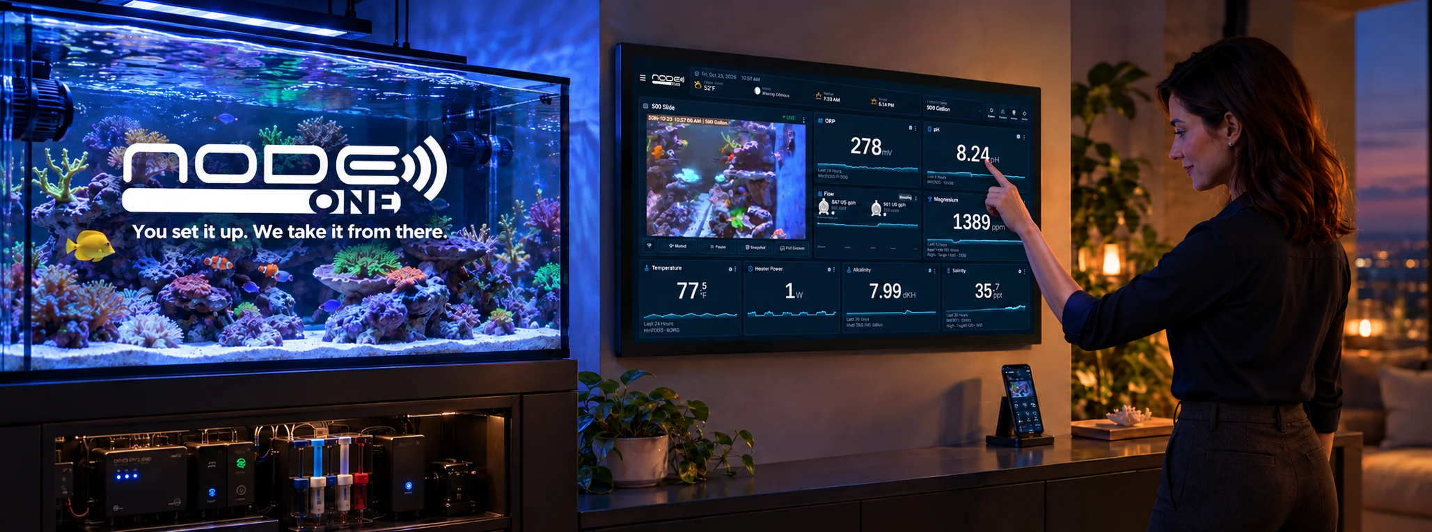 Node ONE reef aquarium command center beside a reef tank, with a woman using the touchscreen